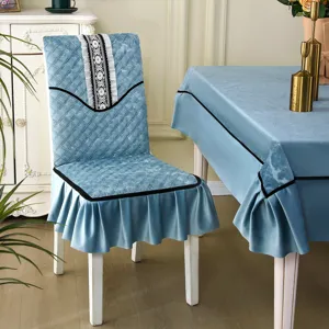Elegant blue velvet chair cover set with quilted pattern and ruffled skirt detail