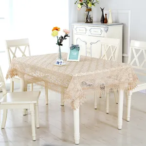 Elegant beige lace tablecloth with floral embroidery and tassel fringe for dining table decor