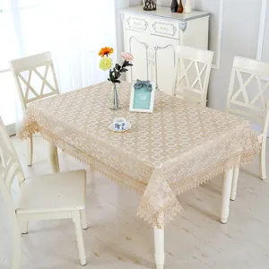 Beige lace tablecloth with vintage floral embroidery and tassel edge for dining tables.