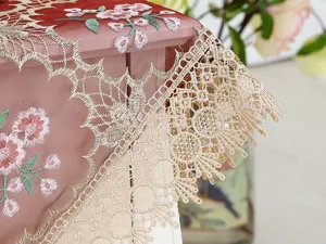 Detailed shot of delicate lace embroidered tablecloth tea table runner home decorative cover