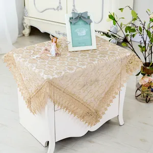 Detailed view of elegant gold lace tablecloth, chic bedside table dust cover for home decor.