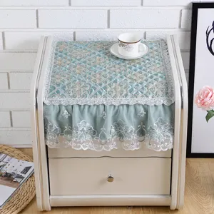 Quilted bedside table dust cover with elegant lace trim and embroidery, multi-functional home decor.