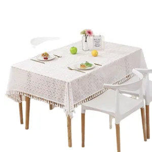 French cream vintage square lace tablecloth with tassels, elegant hollow fabric cover.