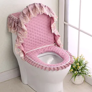 Pink quilted toilet seat cover set with lace ruffle embroidery for bathroom decor.