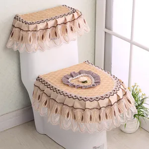 Detail shot of quilted fabric toilet seat cover with lace ruffles and heart decor.