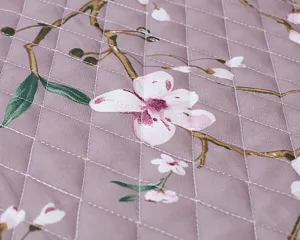 Detail shot of the quilted fabric for the toilet seat cover, featuring pastoral floral print.