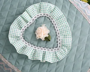 Green quilted toilet lid cover with plaid ruffles and lace trim, cute heart design.