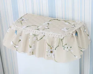 Fabric toilet water tank cover with floral print and lace trim, pastoral style close-up.