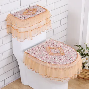 Bloemen toiletzitting hoes set met oranje kant volants voor badkamer decoratie en bescherming.