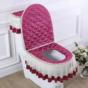 Fabric toilet seat cover set in dark magenta with elegant lace trim, beautiful bathroom decor.