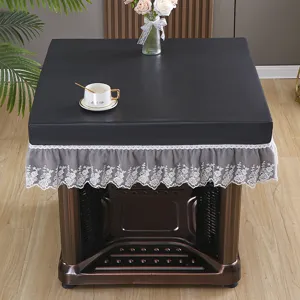 Black PU leather electric stove cover with elegant gray lace ruffle for home table decor.