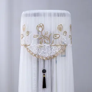 Vertical cylindrical air conditioner dust cover with elegant lace and golden tulip embroidery.