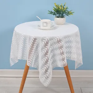 White lace dust cover featuring elegant leaf pattern for bedside table, microwave and appliances.
