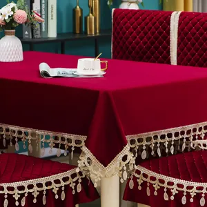 Italian velvet dining tablecloth and chair cover set detail, elegant red fabric with lace trim.