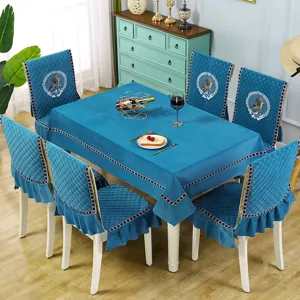 Detailed view of the blue velvet quilted dining chair cover and tablecloth set, elegant home decor.