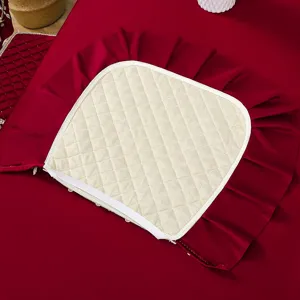 Close-up detail of Italian velvet dining chair cushion set with quilted pattern and elegant ruffle edge.