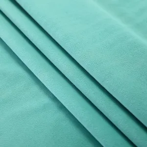 High quality soft velvet fabric material in elegant tiffany blue color for home textiles.