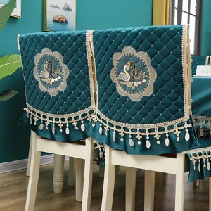 Italian velvet dining chair cover set featuring elegant swan embroidery and lace trim.