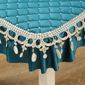 Quilted velvet tablecloth chair cover with elegant gold lace trim and drop details.