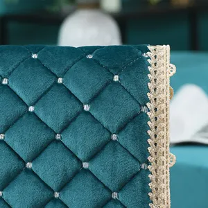 Close-up of Italian velvet chair cushion texture with elegant gold lace trim and quilted design.