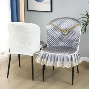 Luxury quilted dining chair cover set with elegant lace embroidery and floral accent.