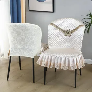Detailed view of luxury quilted dining chair cover with elegant lace trim and all-inclusive back.