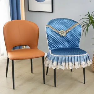 Detailed view of Italian style dining chair cover, quilted blue fabric with elegant lace trim.