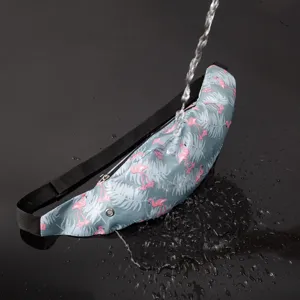Waterproof test on a grey sports fanny pack with pink flamingo and palm leaf print.