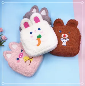 Macro view of cute plush animal shaped storage pouches featuring soft lamb wool texture