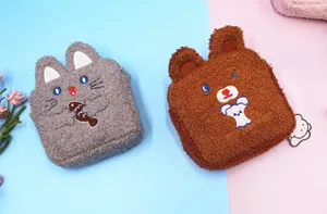 Detailed view of cute plush grey cat and brown bear character cosmetic storage pouches