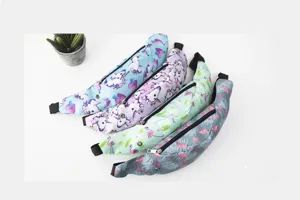 Detail of four printed sports fanny packs with unicorn and flamingo patterns for travel.