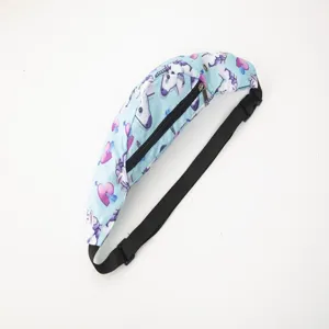 Close-up detail of the colorful unicorn and heart print on a blue travel waist bag.