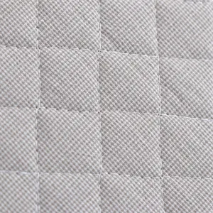 Hoogwaardige gewatteerde stoftextuur close-up met duurzame rasterstiksels voor comfortabel kussen.