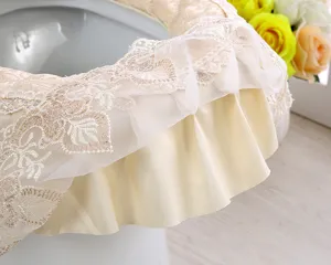 Detail view of Korean style lace velvet toilet seat cover, elegant ruffle design for bathroom.