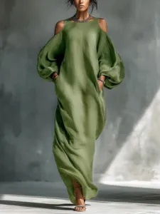 Detail view of the elegant olive green cold-shoulder long sleeve dress, flowing maxi style.