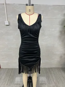 Detailed macro view of a black sleeveless western style dress with fringe and deep V-neck