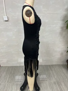 Side view of a vintage western style black slim fit bodycon dress with fringe tassels