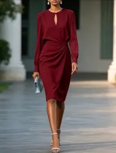 Burgundy long sleeve midi dress with cutout neck and pleated waist for women detail.