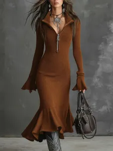 Brown knitted dress detail showing zipper lapel, bell sleeves and fishtail hem.