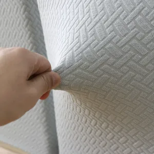 Primer plano detallado del tejido jacquard elástico para fundas de sillas de comedor.