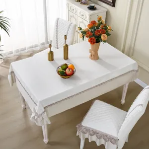 Detailed view of white embossed dining chair cover with elegant lace trim, anti-slip fit.