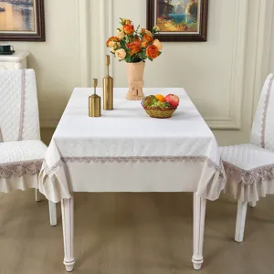 Detailed scene of elegant lace tablecloth and chair cover set, home decor style display.