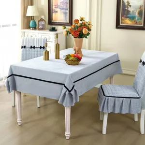 Detailed shot of elegant grey dining table cloth and matching chair cover set home decor.