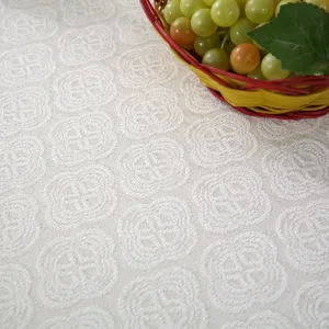 Close-up detail shot of textured fabric with elegant clover pattern, soft touch and fine workmanship.