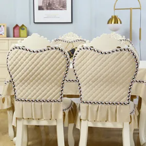 European style dining chair cover set with quilted beige design, elegant ruffles and fine borders.