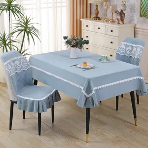 Light blue embossed dining table cloth and chair cover set with elegant white lace trim.