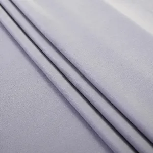 Detailed close-up view of soft light purple velvet upholstery fabric with smooth and elegant texture.