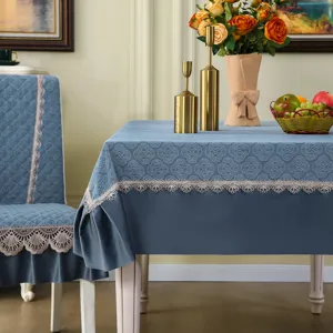 Dusty blue dining chair cover and tablecloth set with delicate beige lace trim for home decor.