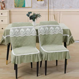 Sage green quilted dining chair cover with elegant white lace ruffle embroidery detail view