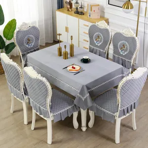 European style tablecloth and chair cover set with lace trim and elegant embroidery.